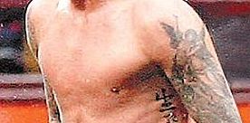 Tatuaggio Beckham angelo-guardiano braccio sinistro